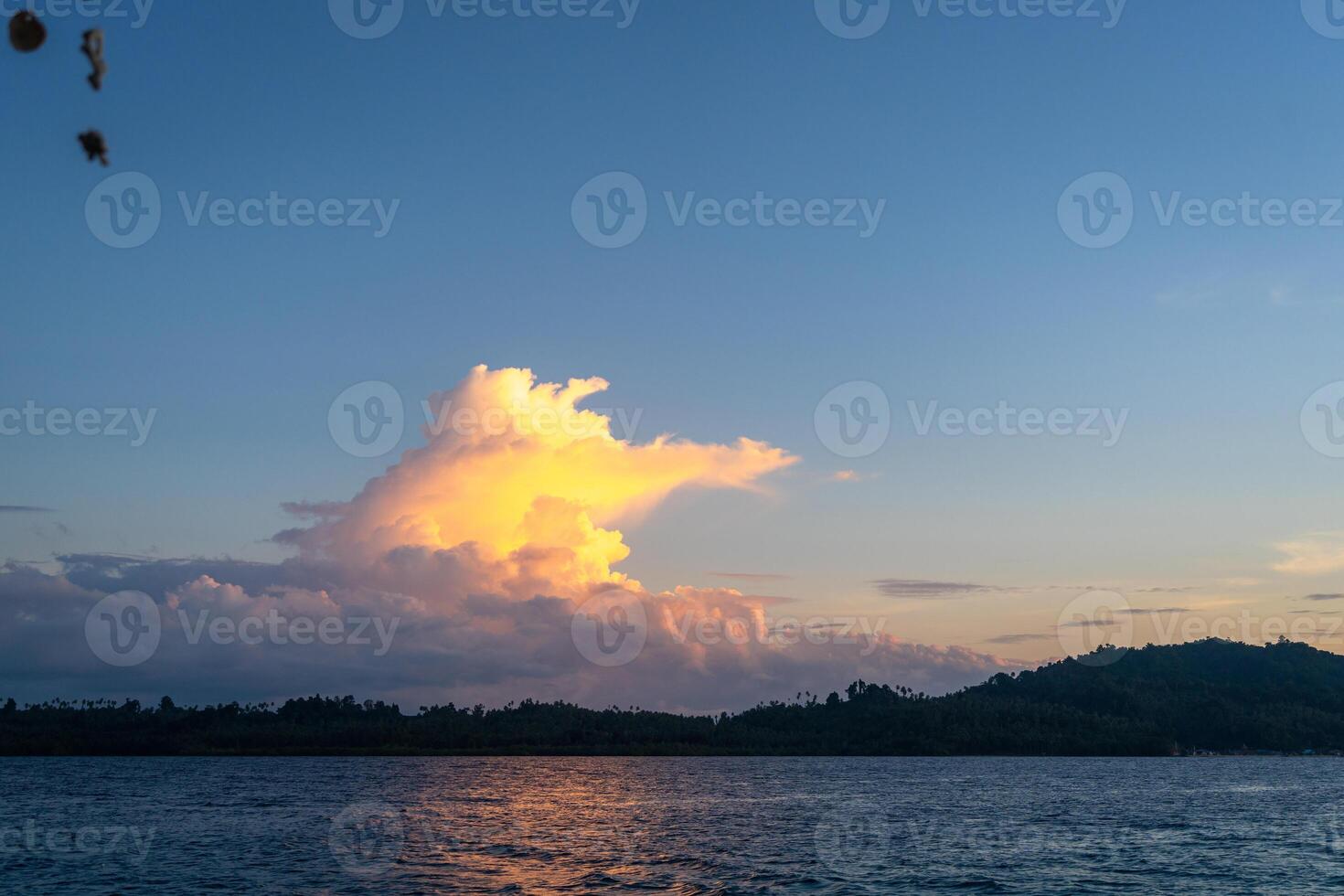 The Sunset over Bolilanga Island, Togian archipelago, Sulawesi, Indonesia photo