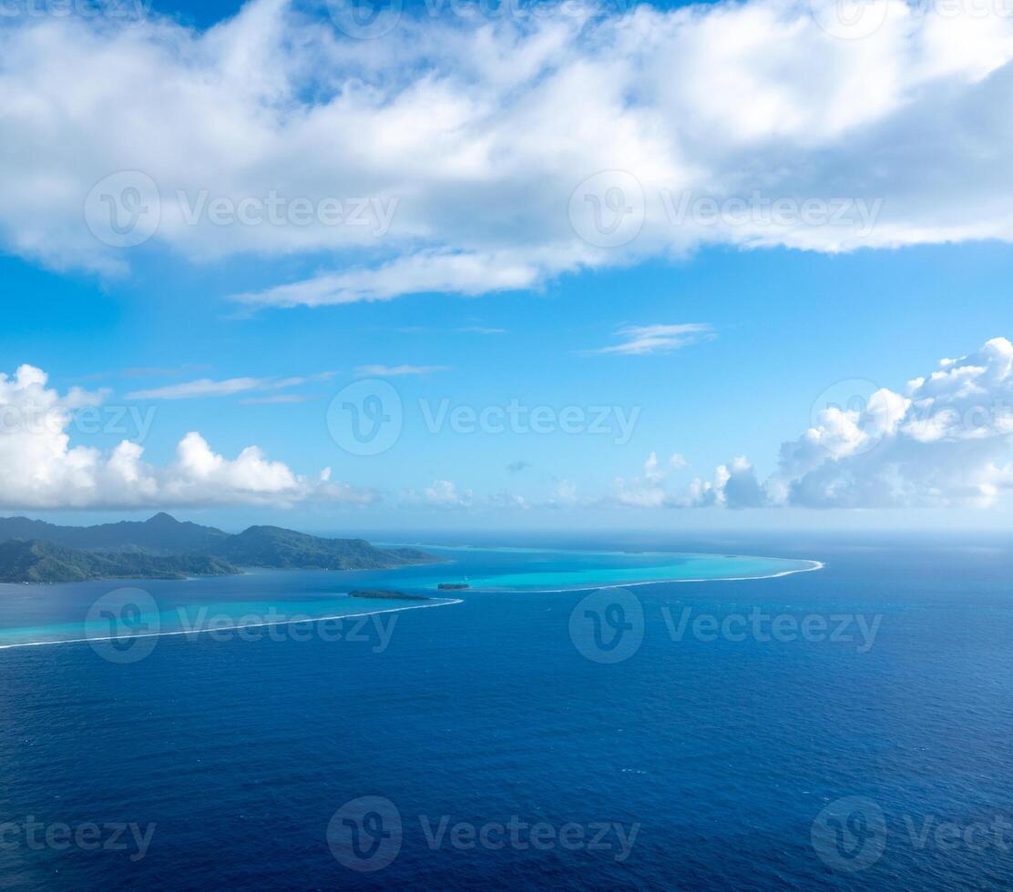 An Aerial view of Tahaa island, French Polynesia, with turquoise lagoon and reef photo