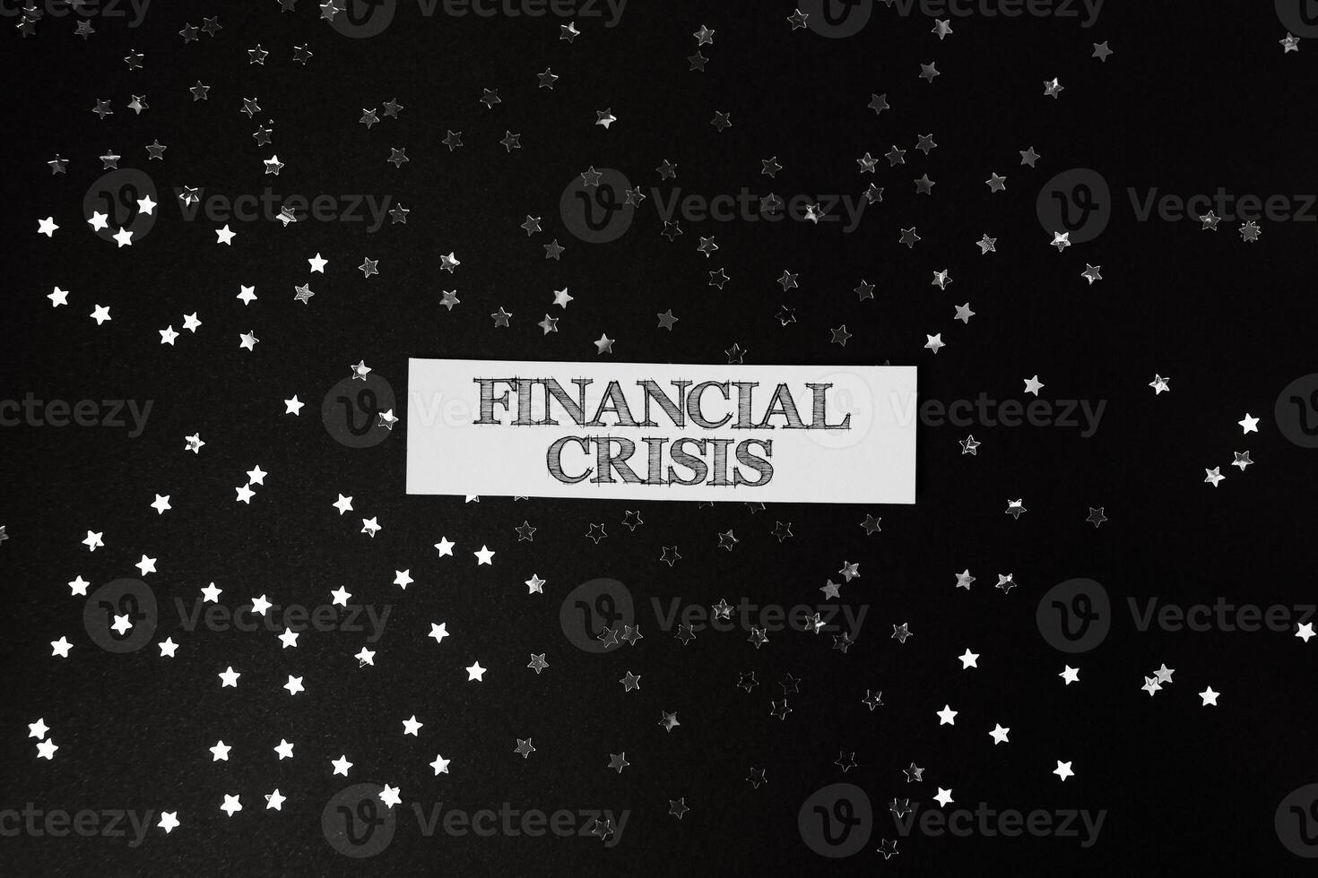 Black background with a white sign that says financial crisis photo
