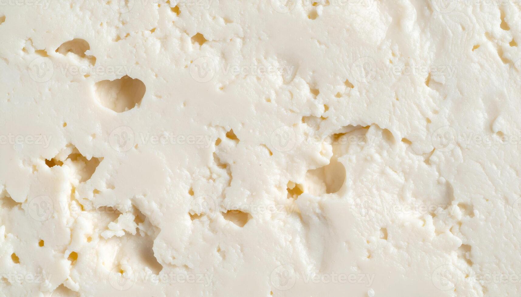 tofu surface close-up with porous texture and white soft appearance, healthy vegan ingredient background for food design and mockup photo