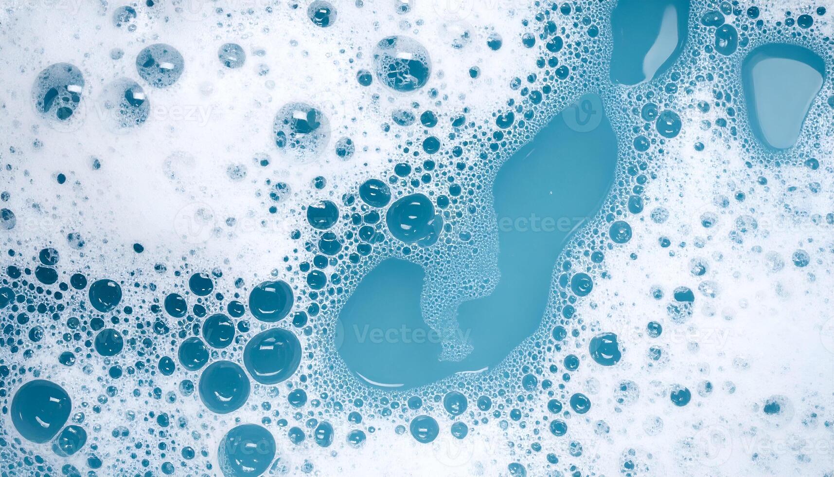 macro view of blue soap water surface with frothy foam bubbles, top down abstract hygiene and cleaning texture background photo