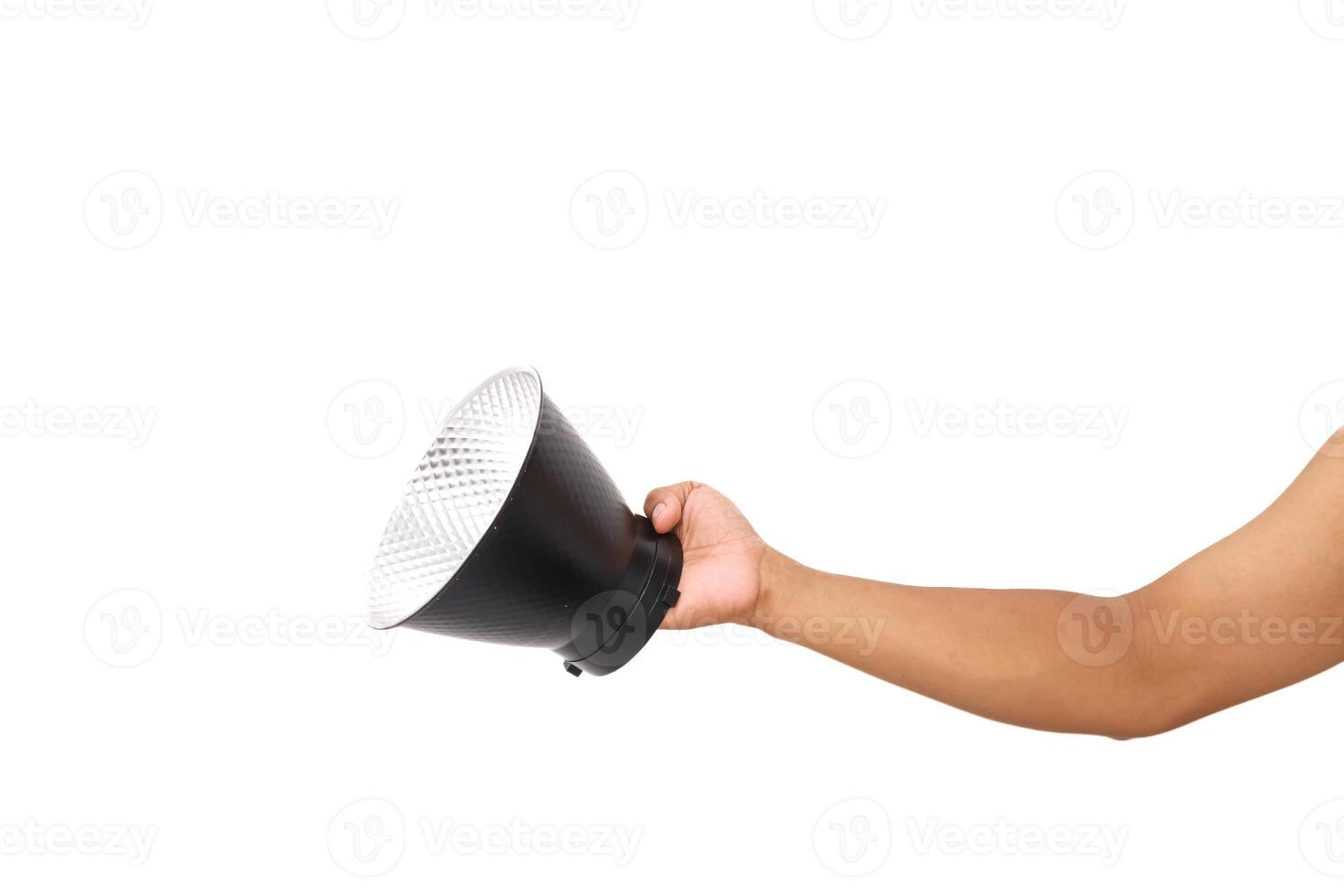 Hand holding a studio reflector, showcasing photography equipment on white background photo