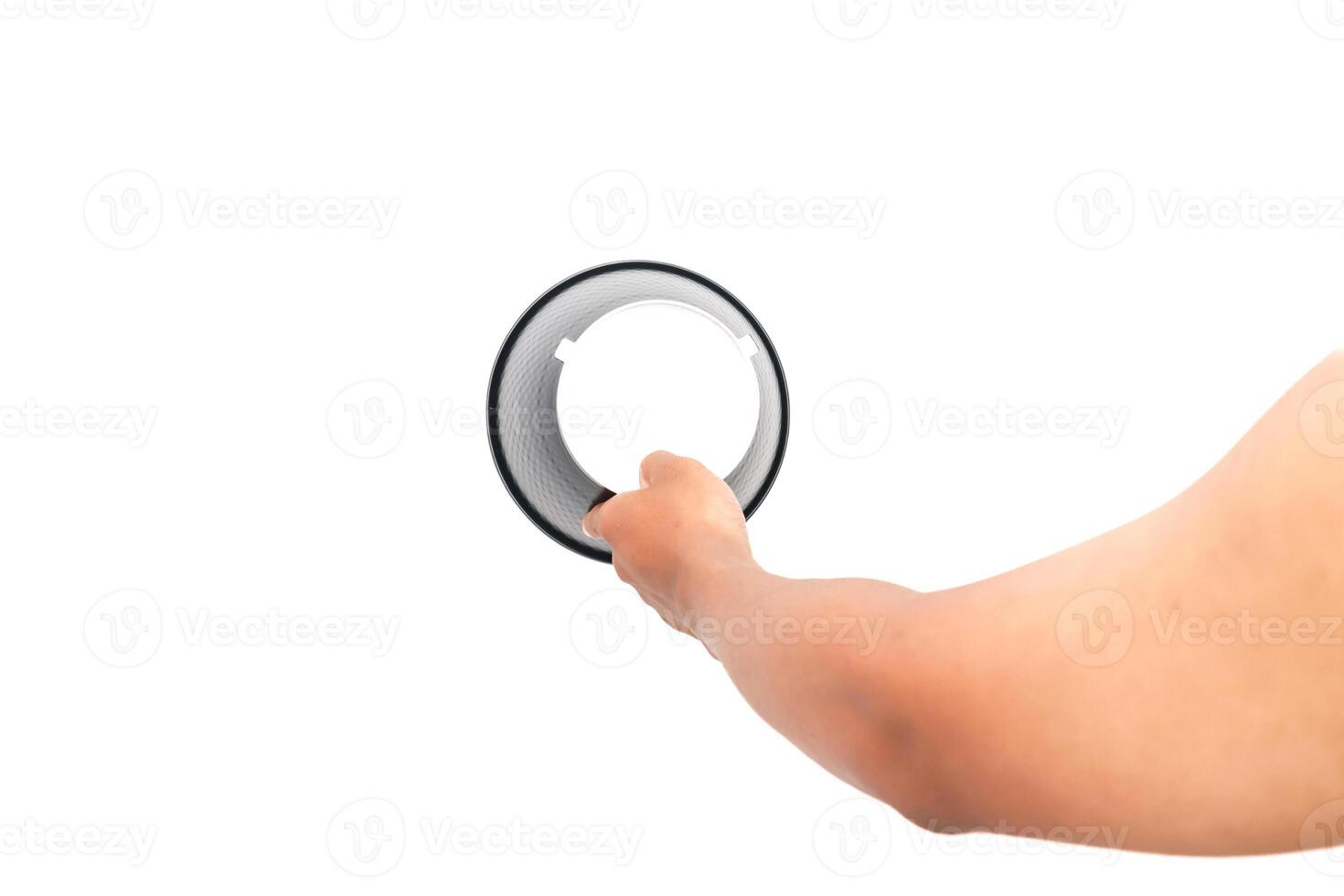 Hand holding a ring light with white background studio shot for product photography photo