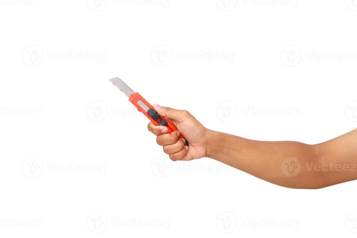 Studio shot of a hand holding a box cutter, isolated against a white background, sharp equipment photo