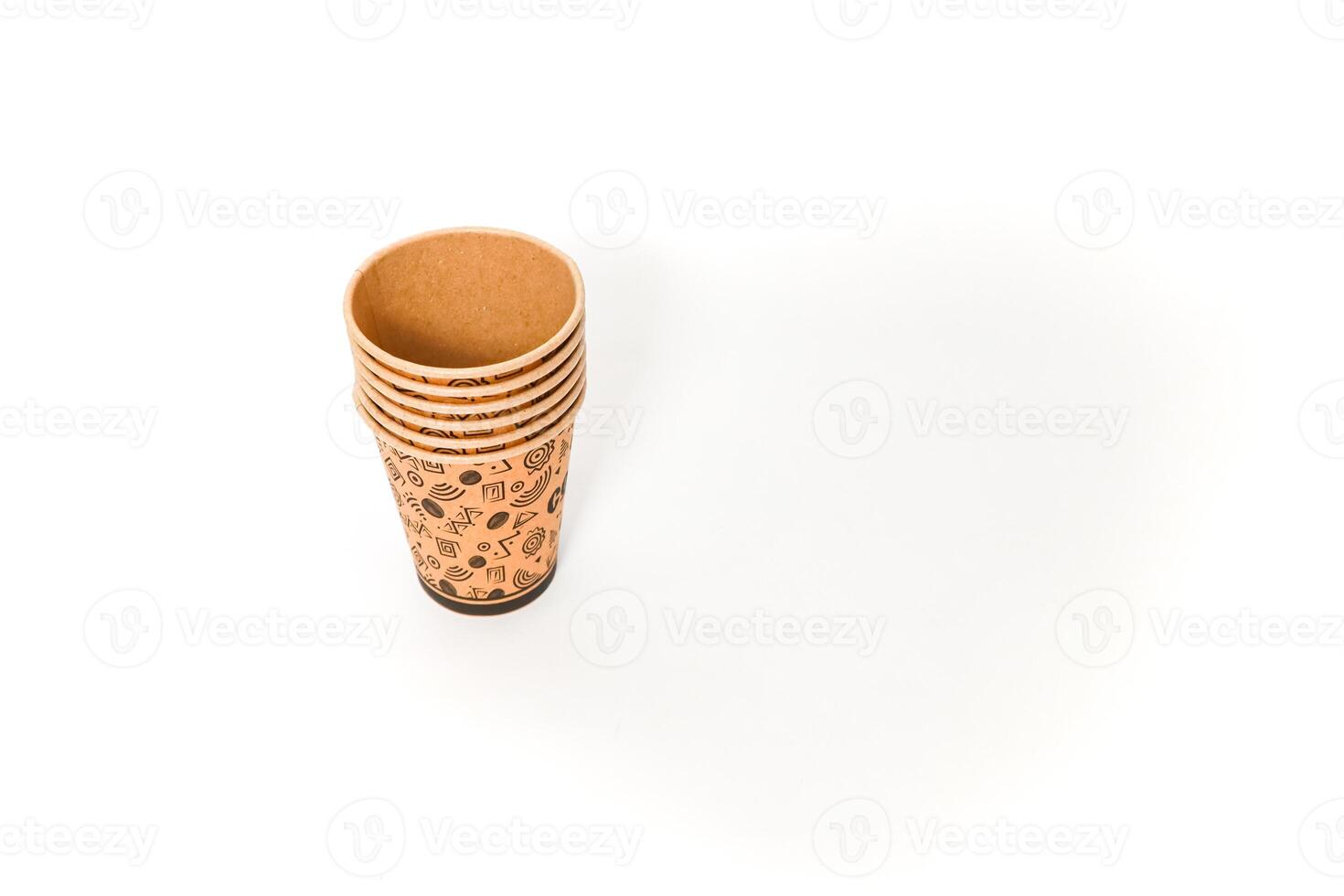 Stack of Disposable Paper Cups with Coffee Design on White Background, perfect for branding mockup and promoting eco-friendly choices photo