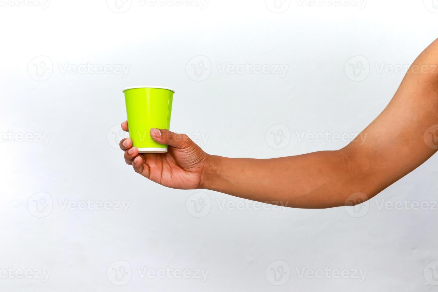 Hand Holding a Bright Green Disposable Cup Against a White Background Showing Arm photo