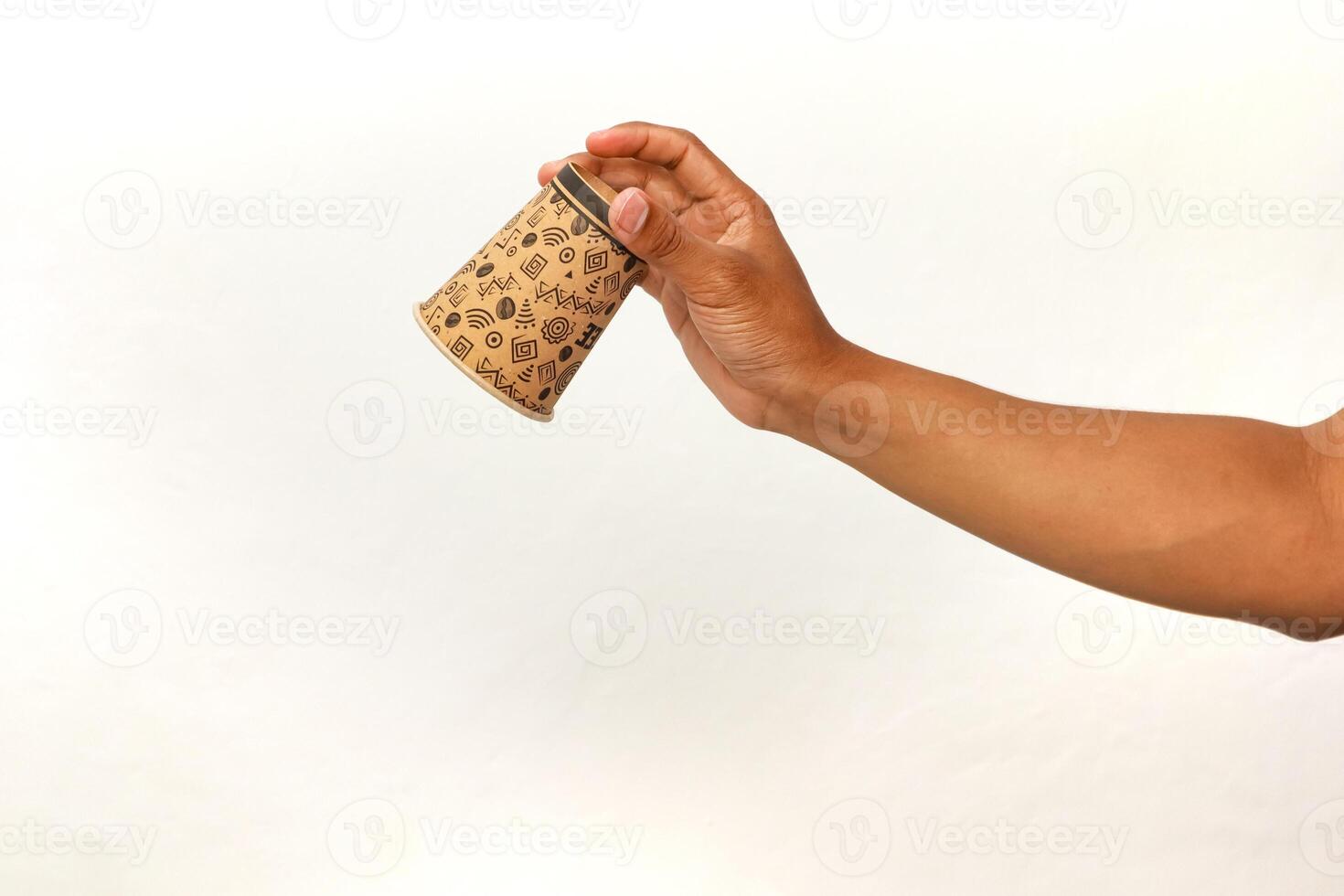 A person holding a patterned paper cup against a white background, coffee break photo