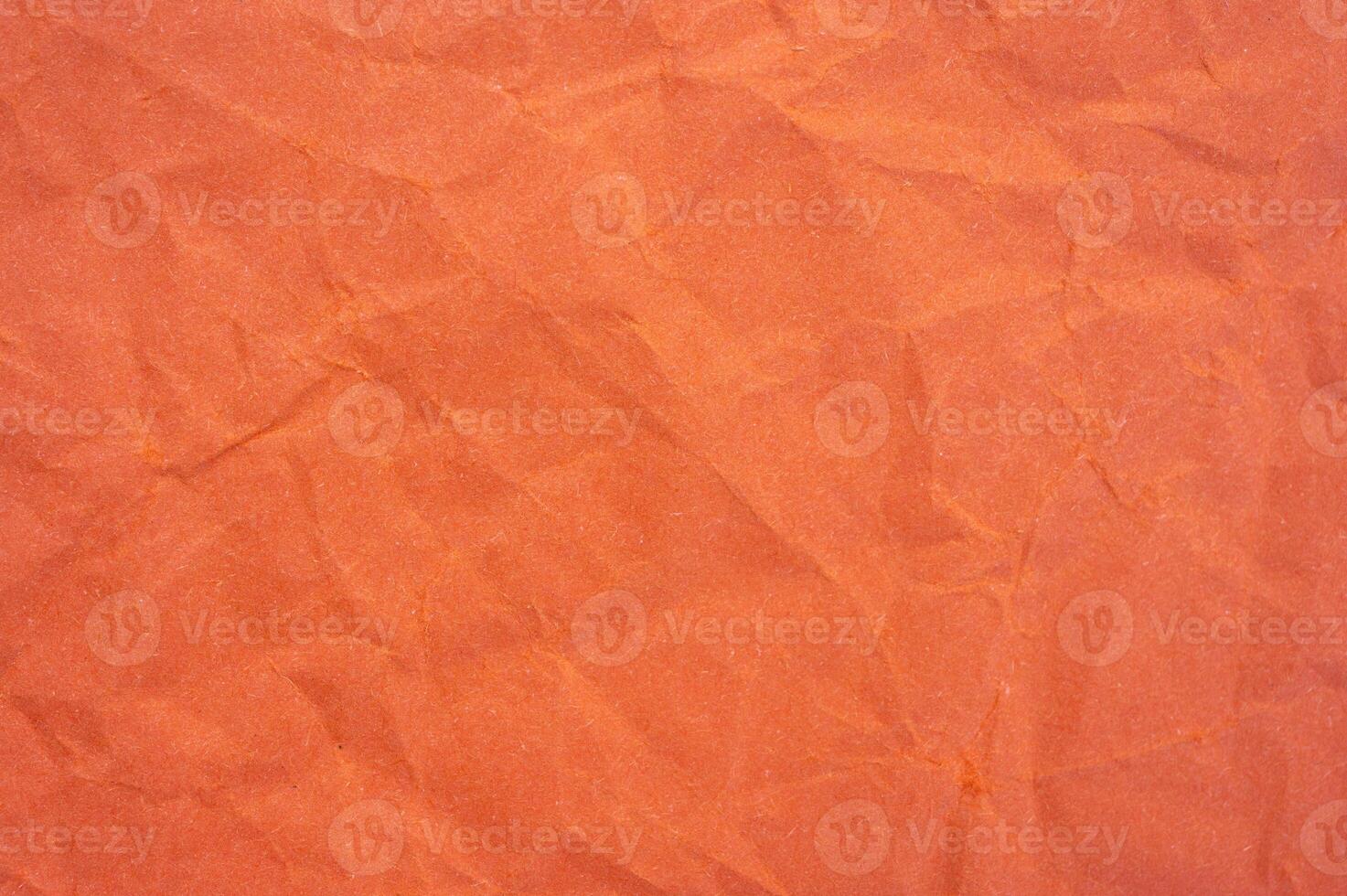 Full frame shot of crumple orange colour paper sheet texture and background. photo