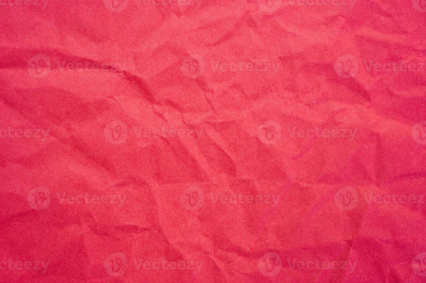 Full frame shot of crumple red paper sheet texture and background. photo