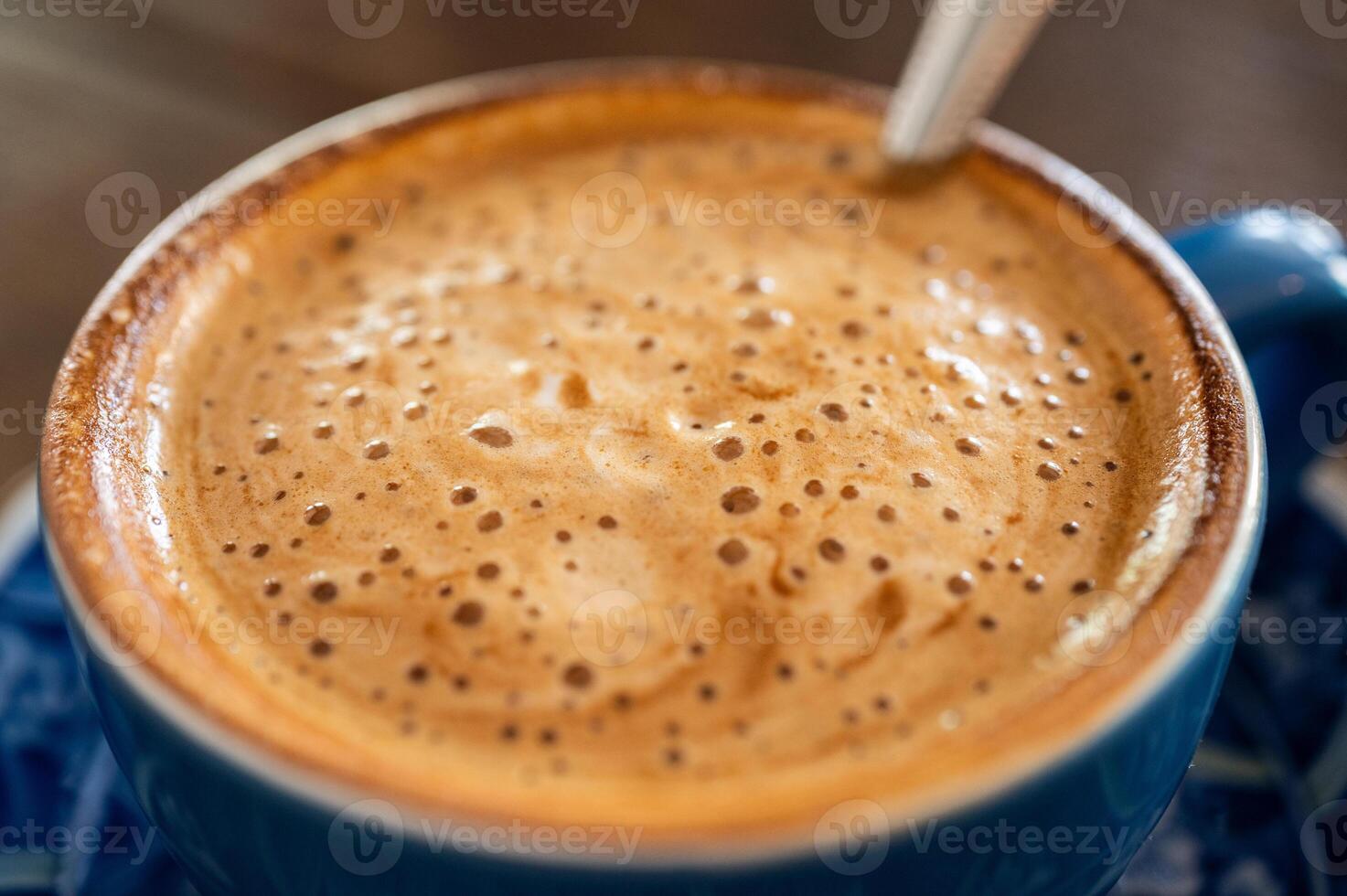 Close up of the surface of hot latte coffee. photo