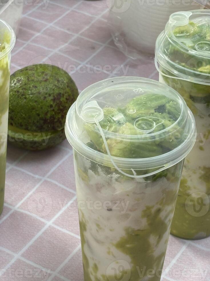 A table with four plastic containers with food in them photo