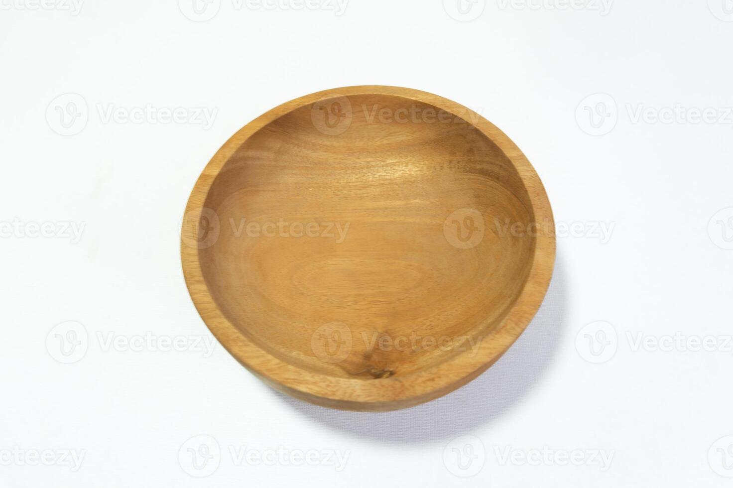Elegant minimalist wooden bowl studio shot capturing its natural texture photo