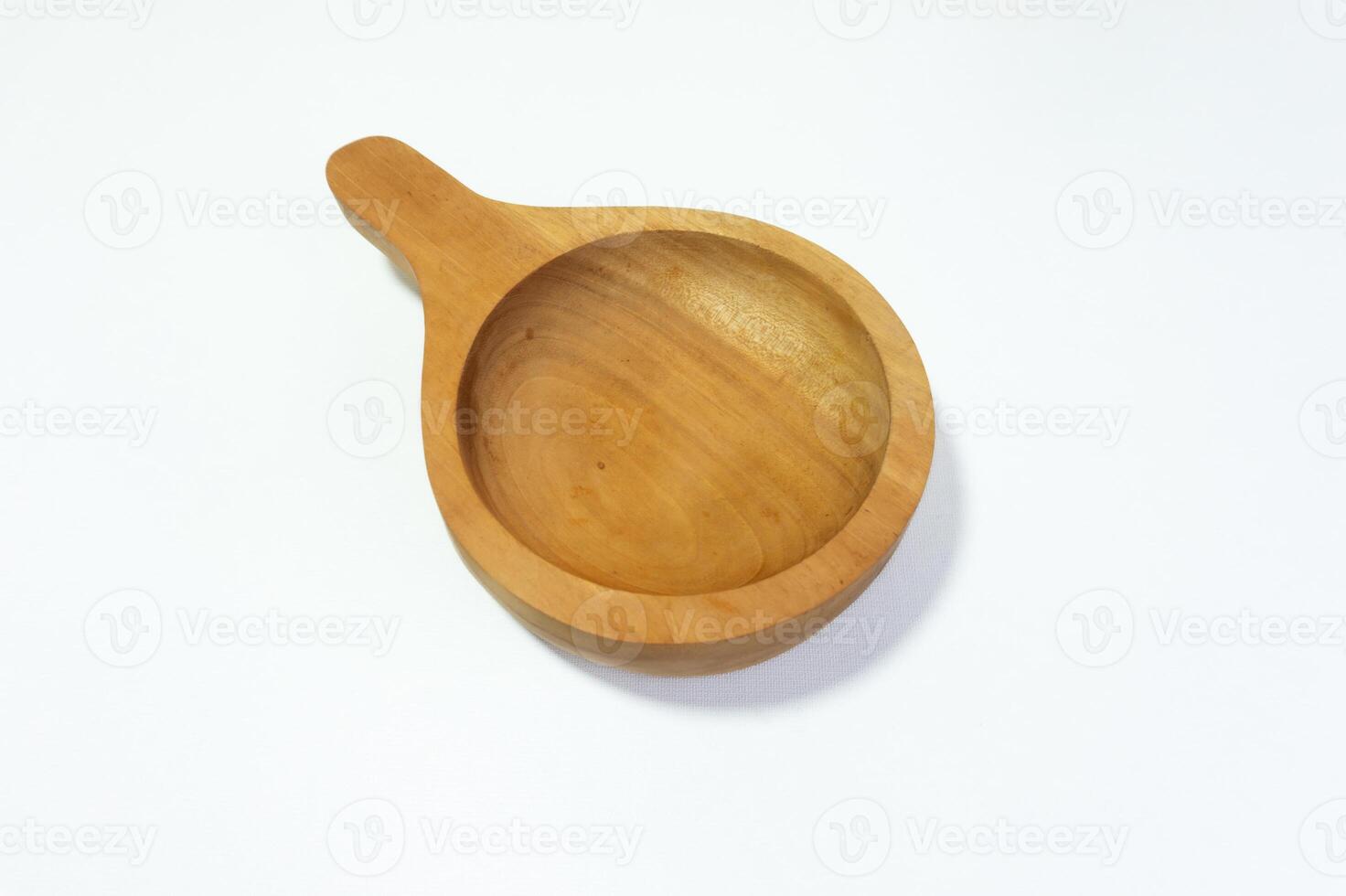 Isolated wooden bowl with handle on white background showcasing craftsmanship photo