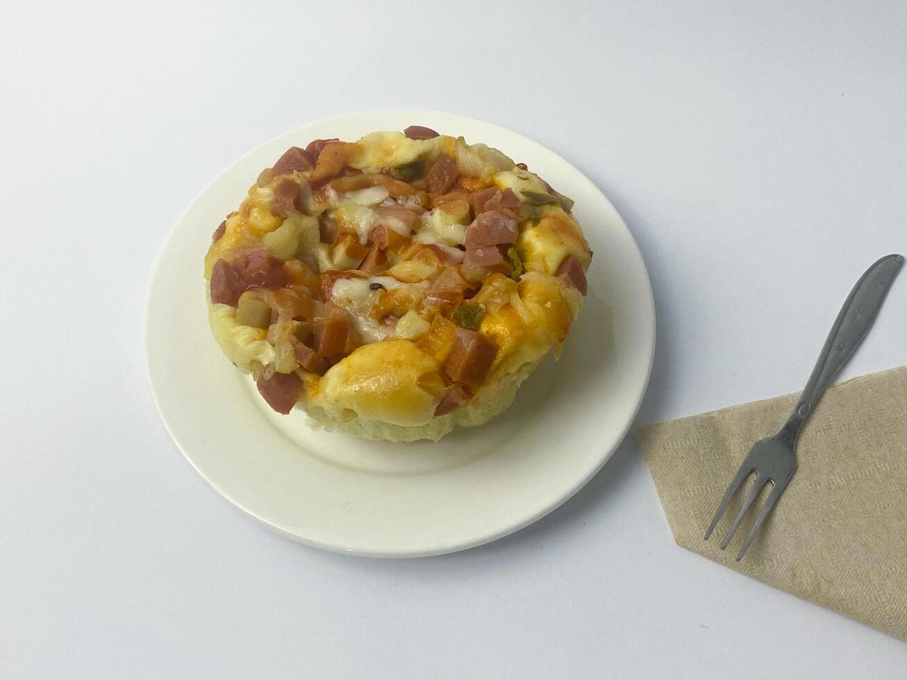 Delicious savory pastry with ham and cheese, served on a plate ready to eat photo