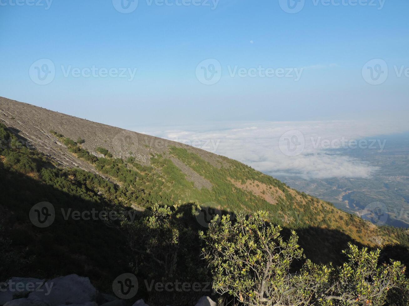 a view of a mountain from a hill photo