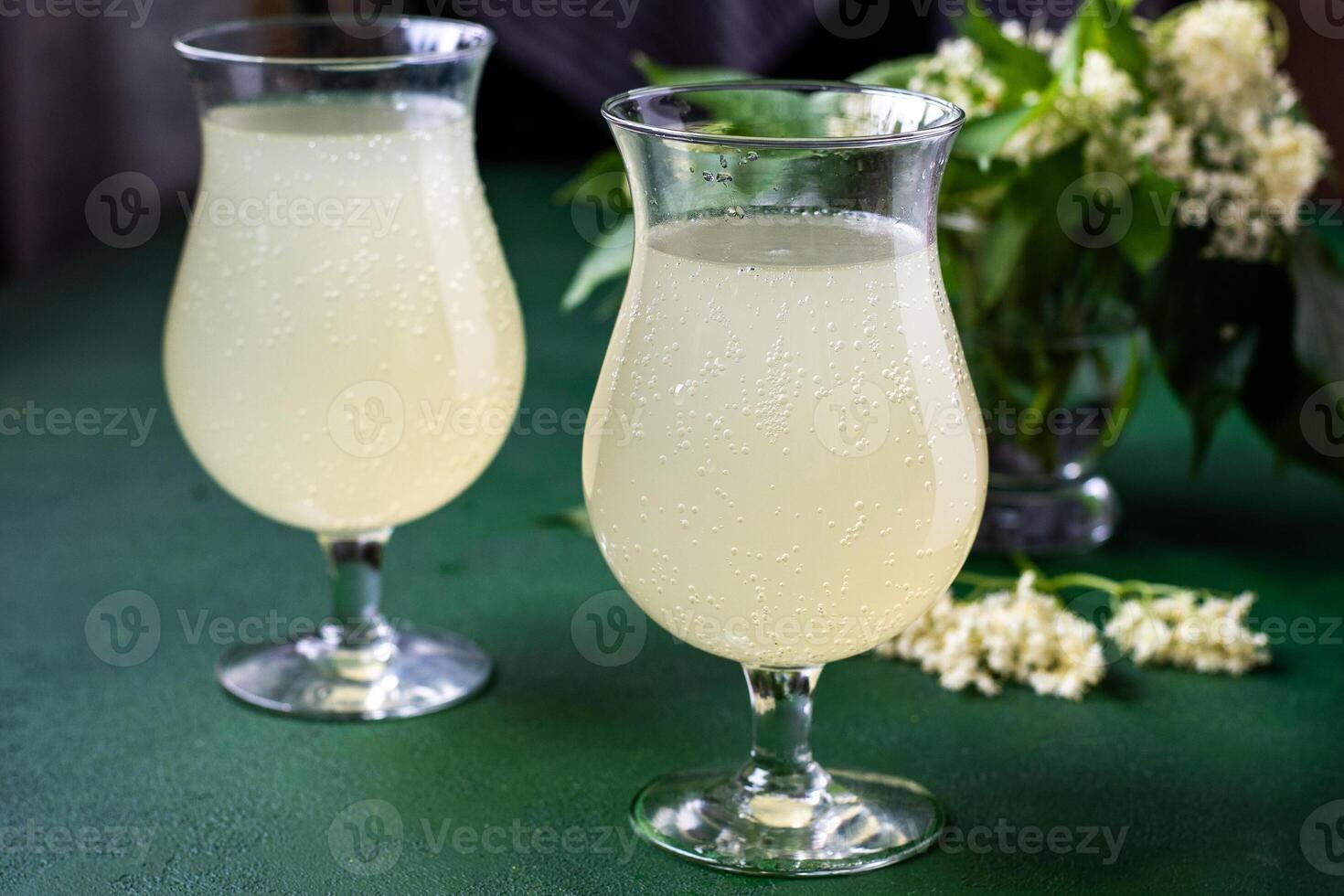 Carbonated elderflower cold drink. Flower summer kvass in glasses photo