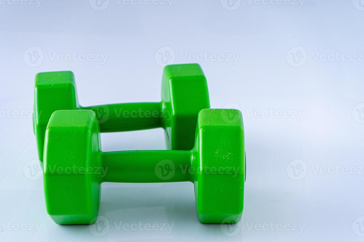 Two dumbbells 2 kg each. Sports equipment. White background. Gym photo