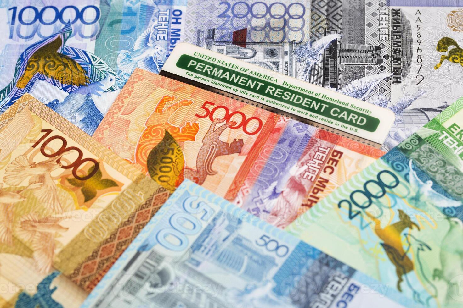 American Permanent Resident Card on Kazakhstani tenge photo