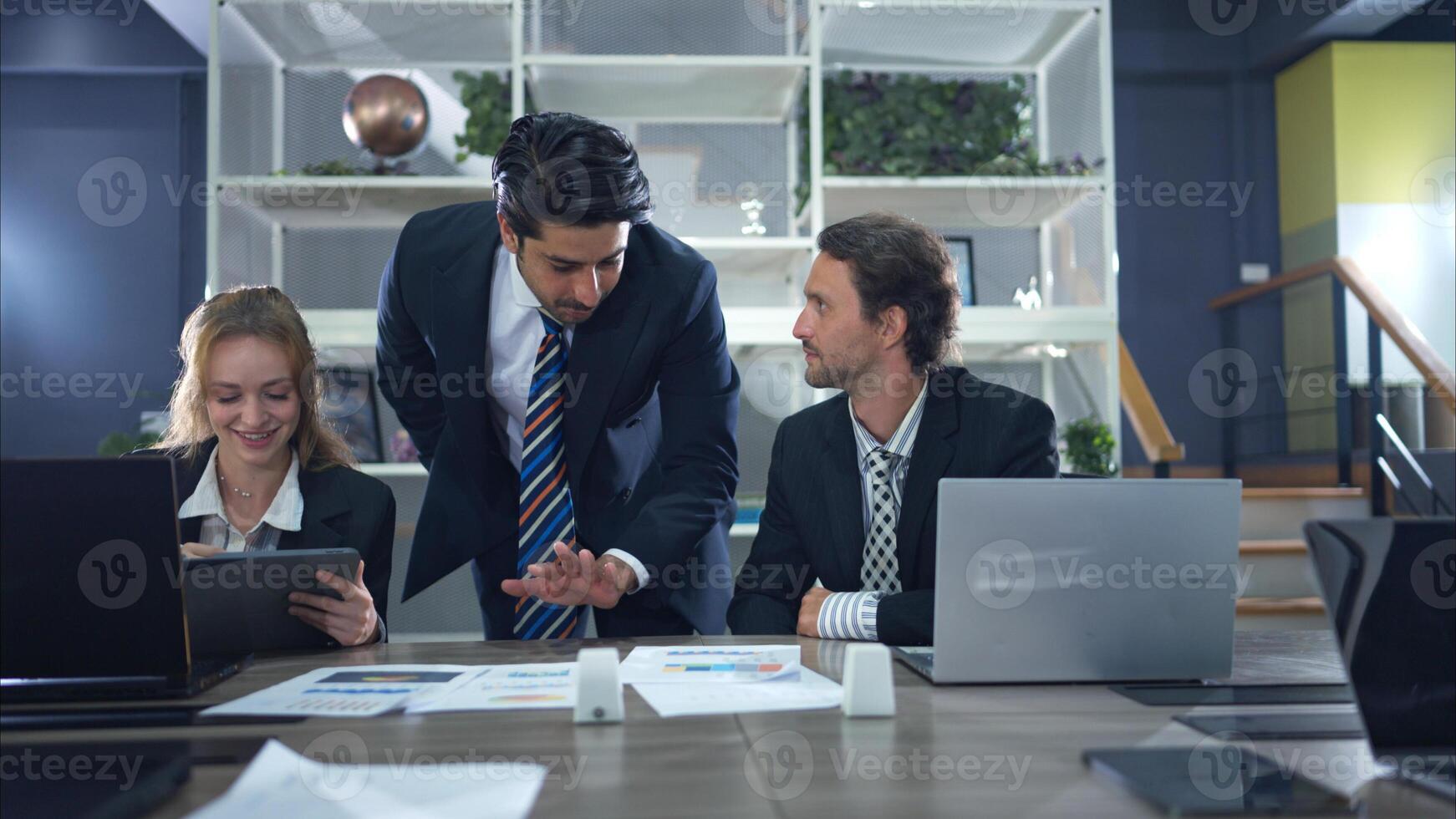 In the conference room, a group of businesspeople are discussing the follow-up meeting and the results of operations,94 photo