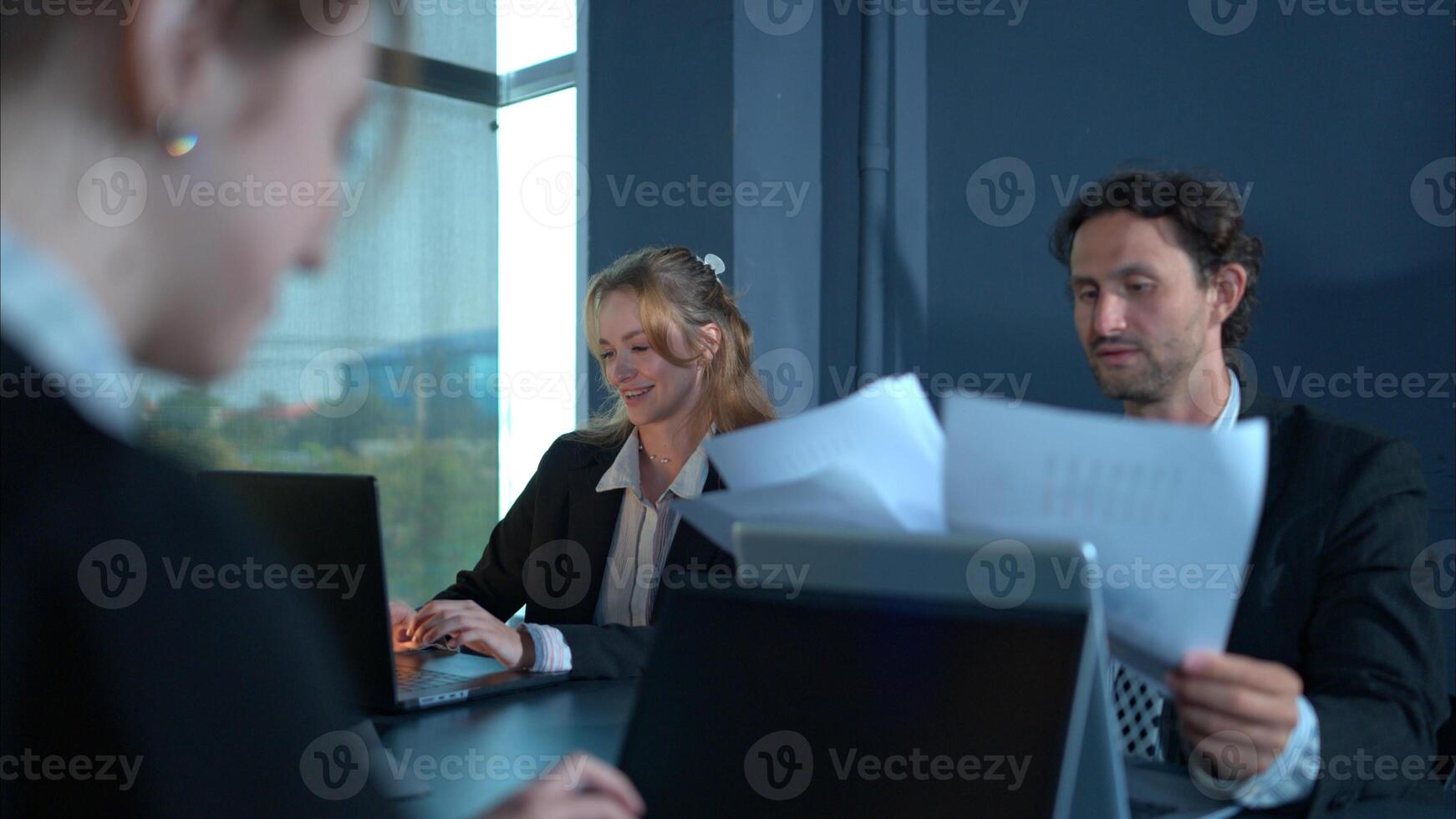 In the conference room, a group of businesspeople are discussing the follow-up meeting and the results of operations,62 photo