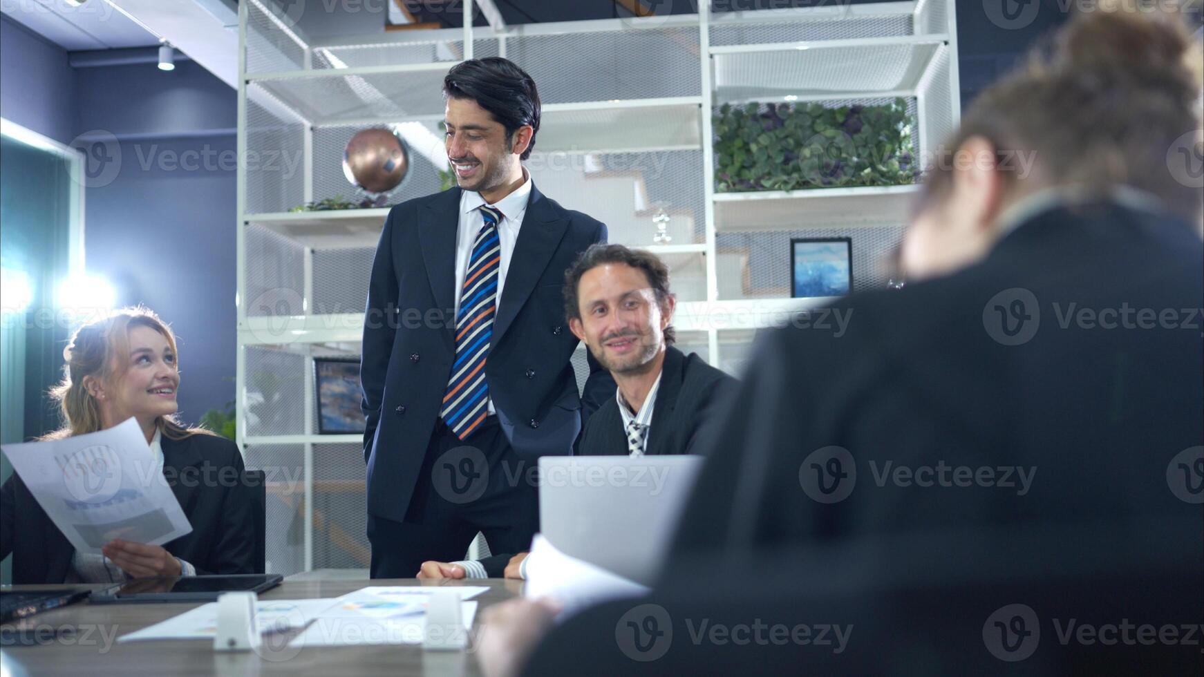 In the conference room, a group of businesspeople are discussing the follow-up meeting and the results of operations,42 photo