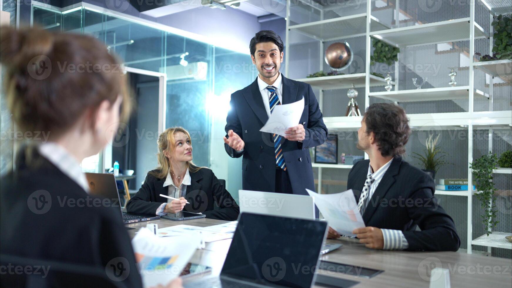In the conference room, a group of businesspeople are discussing the follow-up meeting and the results of operations,34 photo
