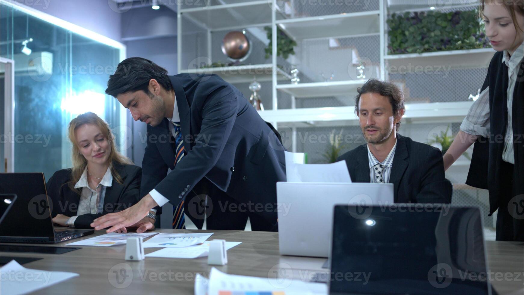 In the conference room, a group of businesspeople are discussing the follow-up meeting and the results of operations,24 photo