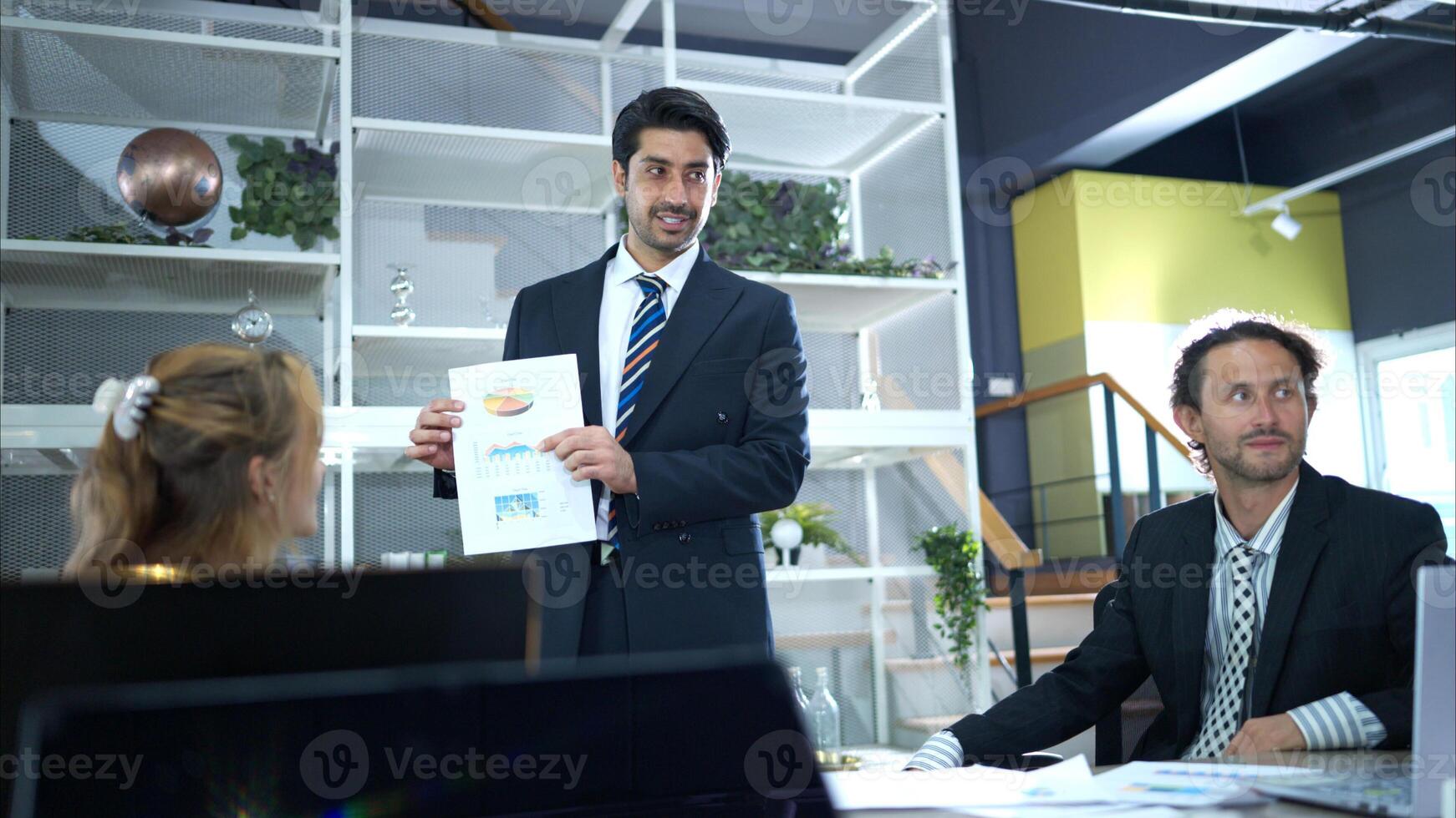 In the conference room, a group of businesspeople are discussing the follow-up meeting and the results of operations,15 photo