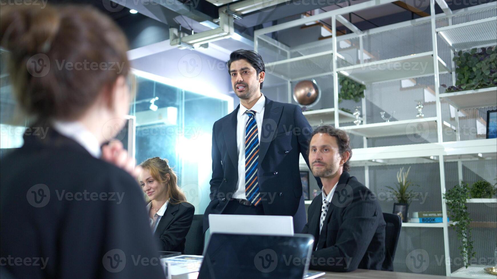 A group of businesspeople are discussing the follow-up meeting and the results of operations. photo