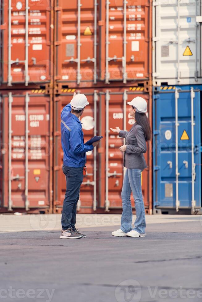 Container manufacturing manager and businesswomen survey ,154the area to plan the storage and moving of goods in and out of the container storage area photo