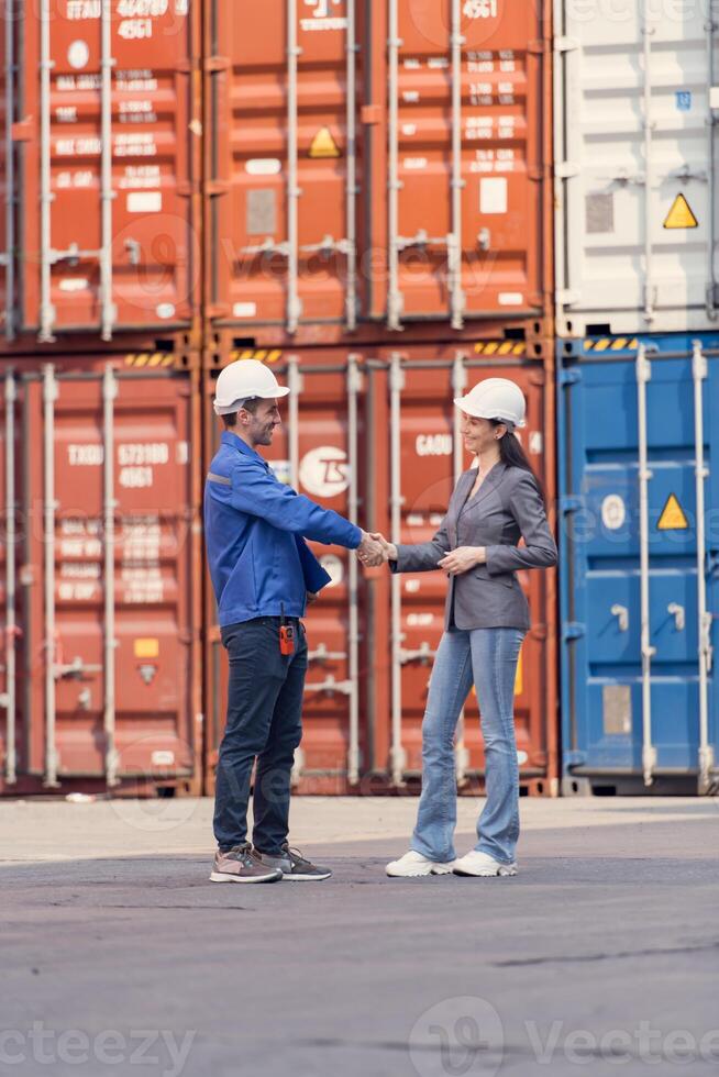 Container manufacturing manager and businesswomen survey the area to plan the storage and moving of goods in and out of the container storage area,106 photo