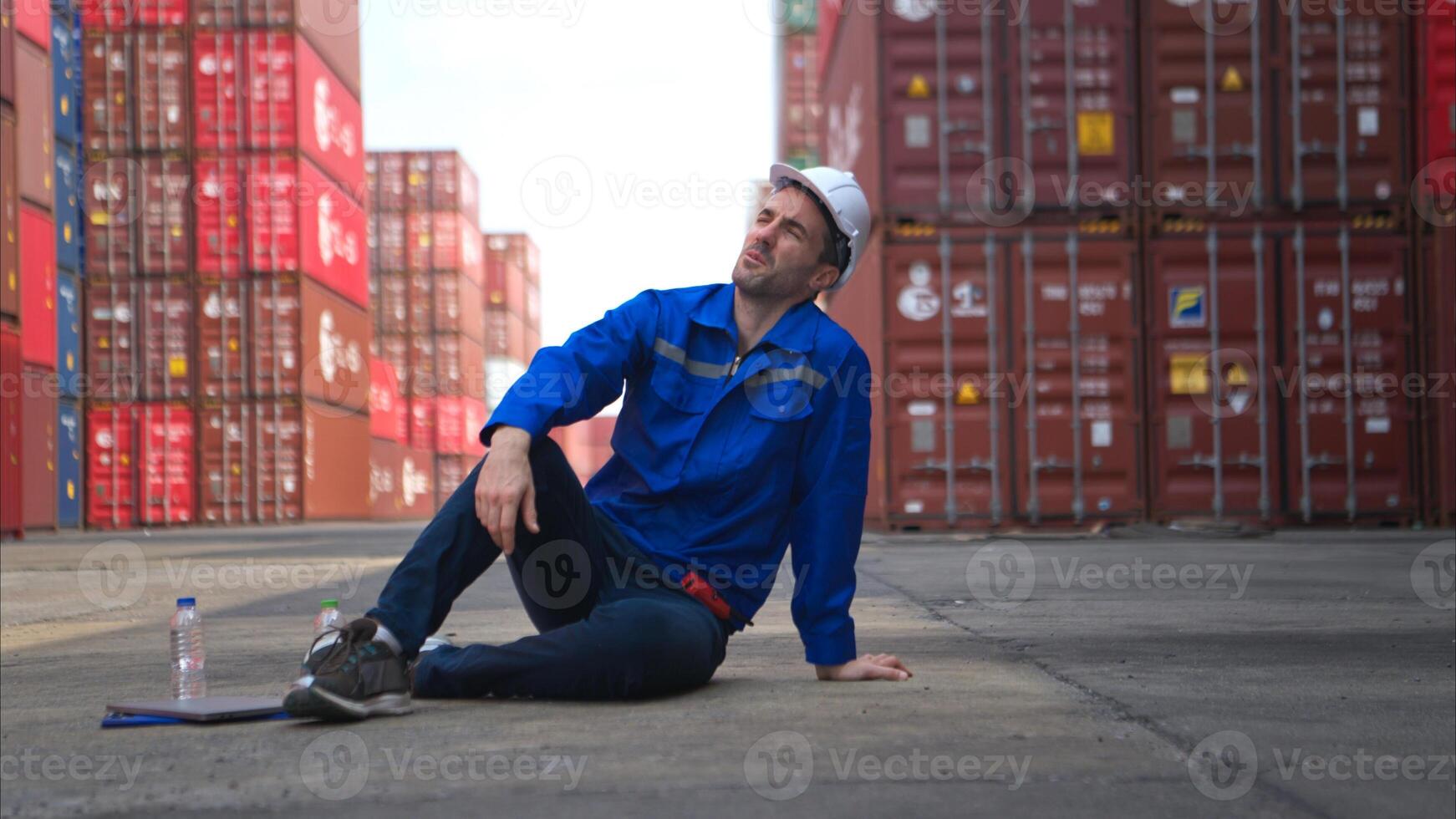 A worker in a container warehouse fainted while working in the bright sunlight,35 photo