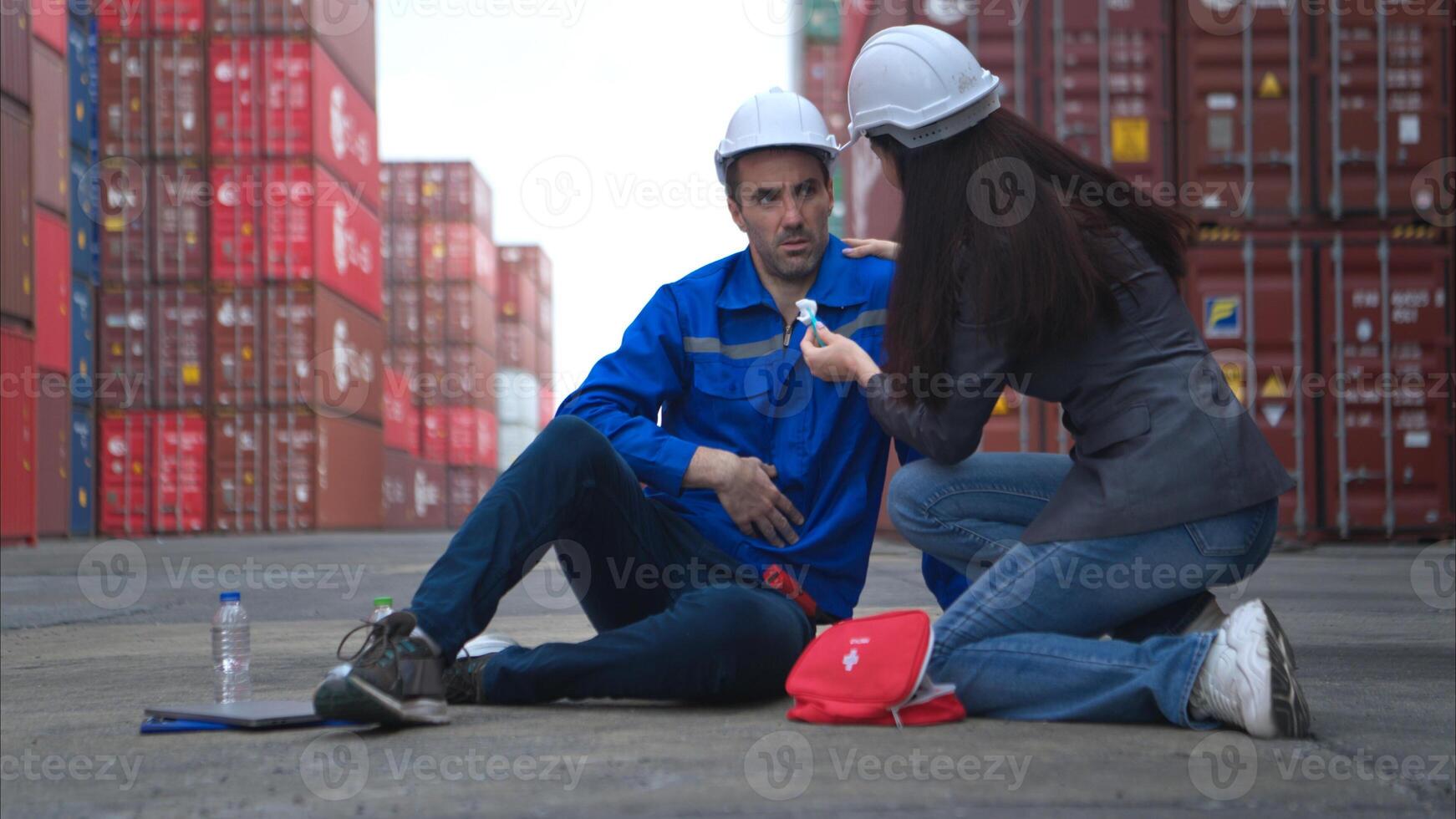 First aid for a container warehouse worker fainted while working in the bright sunlight,14 photo