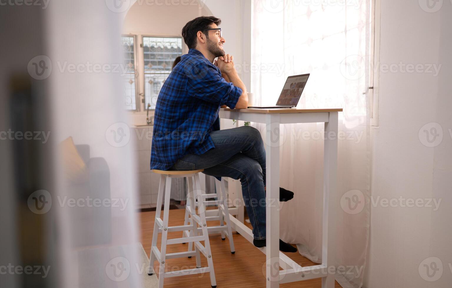 Portrait of a young freelancer smiling while working online via laptop at home with his girlfriend,11 photo