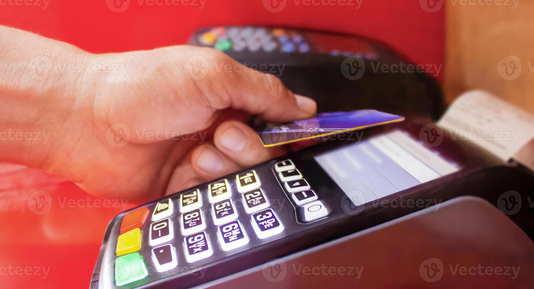 a person is using a credit card photo