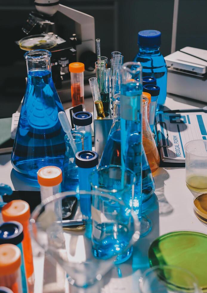 A table with many different colored liquids photo