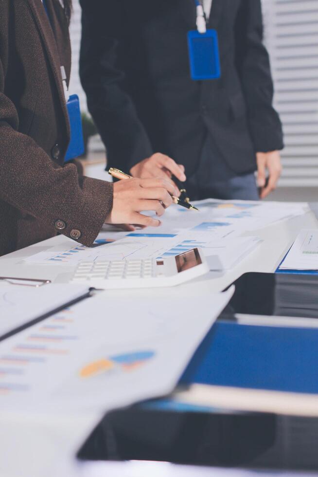 A man and woman are working on a business project photo