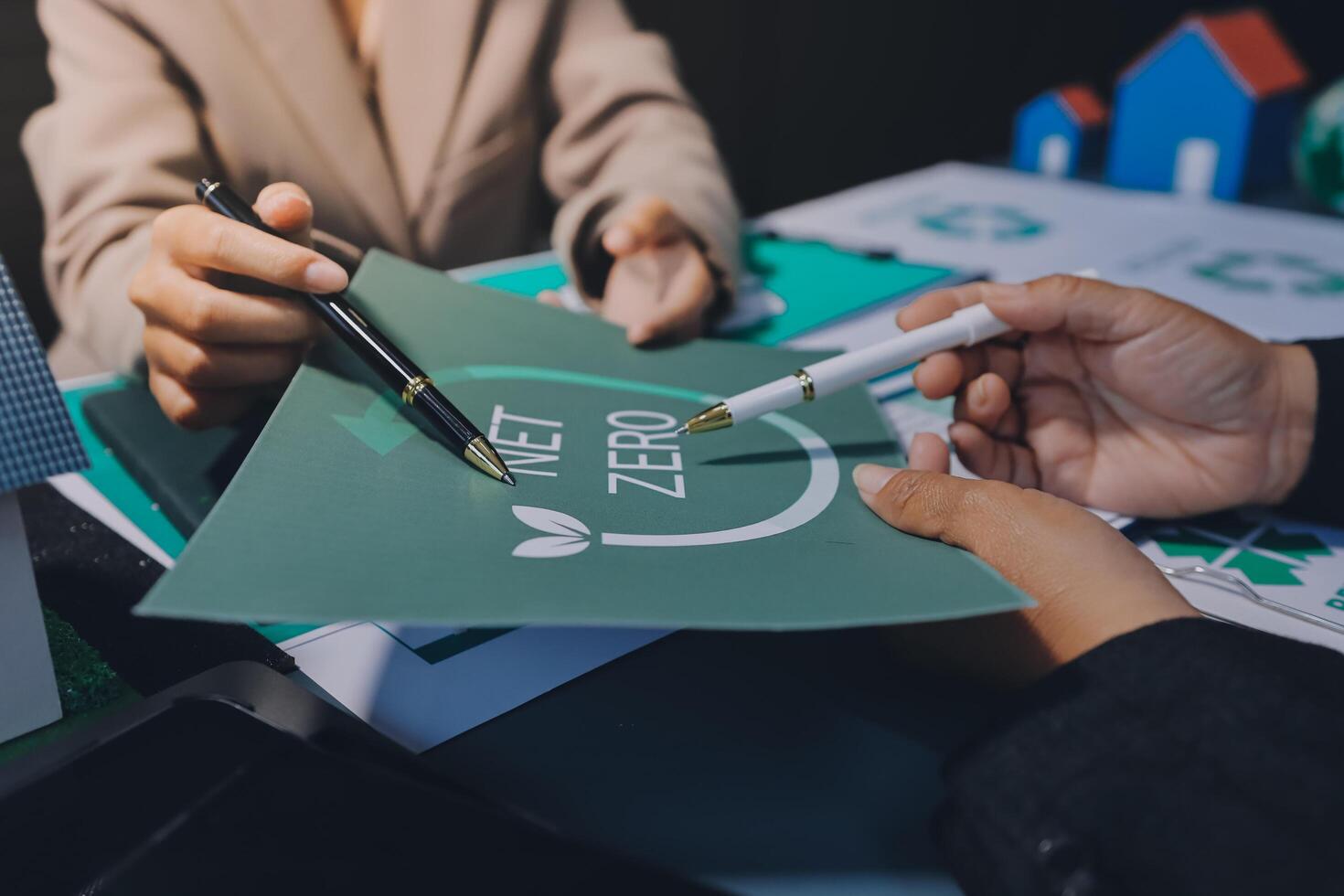 Zero waste concept business people working on paper with eco-friendly logo photo