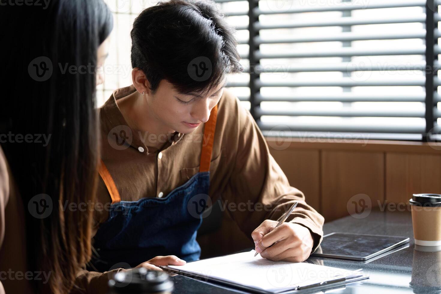 Entrepreneur collaborating on business ideas in a modern cafe photo