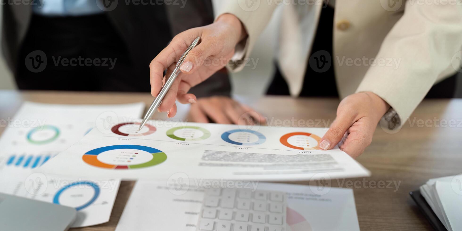 Business Collaboration and Financial Analysis. Professionals reviewing data reports together. photo