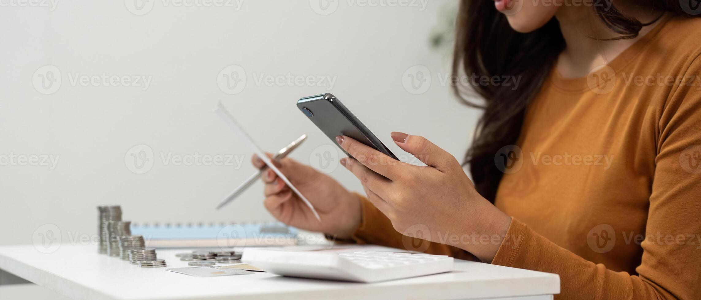 Digital Financial Management. Woman using smartphone for budgeting and expense tracking. photo