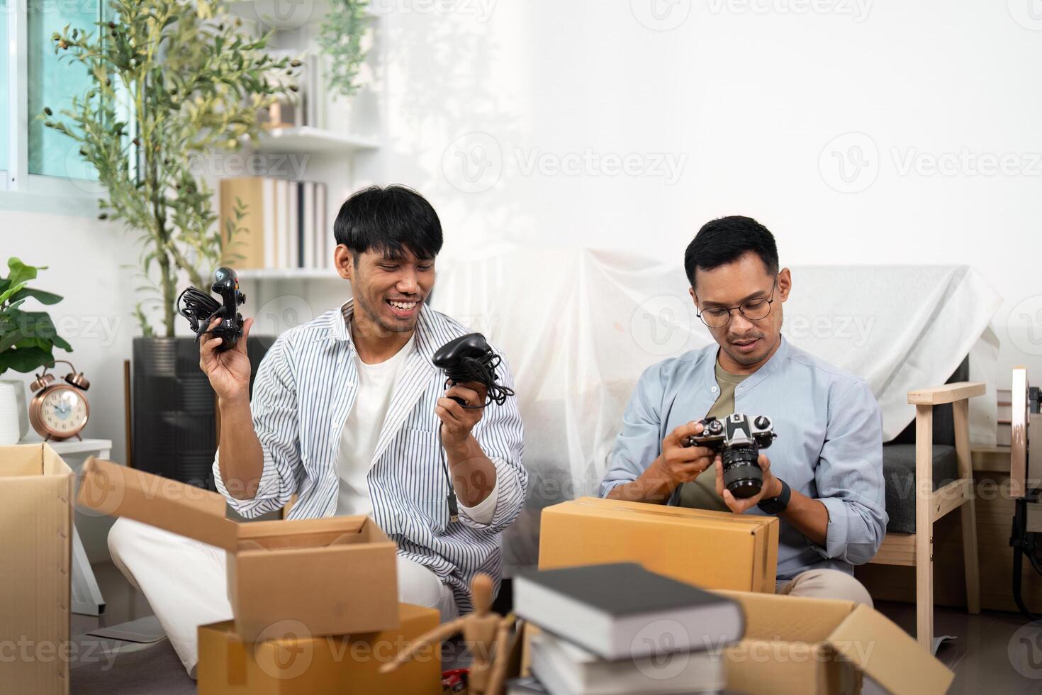 Gay couple exploring new photography gear while unpacking photo
