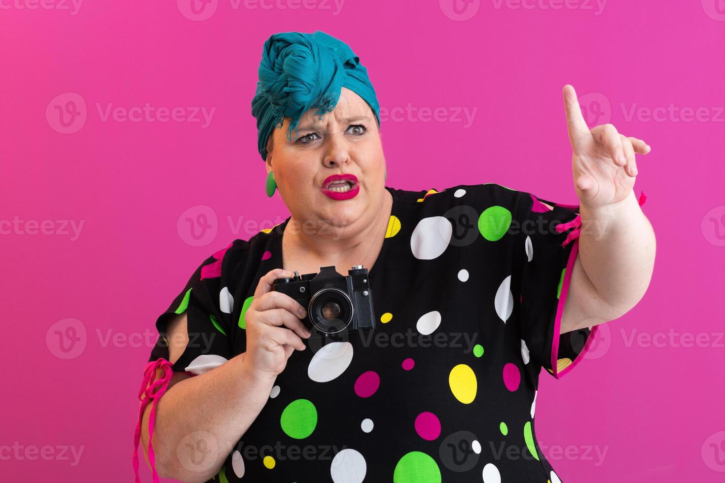Plus size woman giving instructions with camera photo