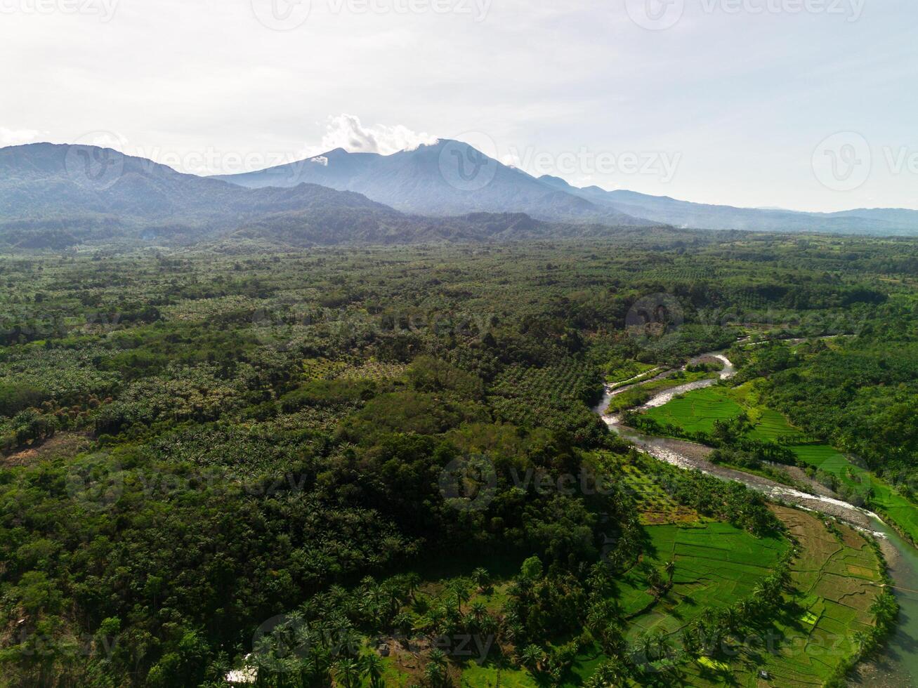A view of a valley and mountains from above photo