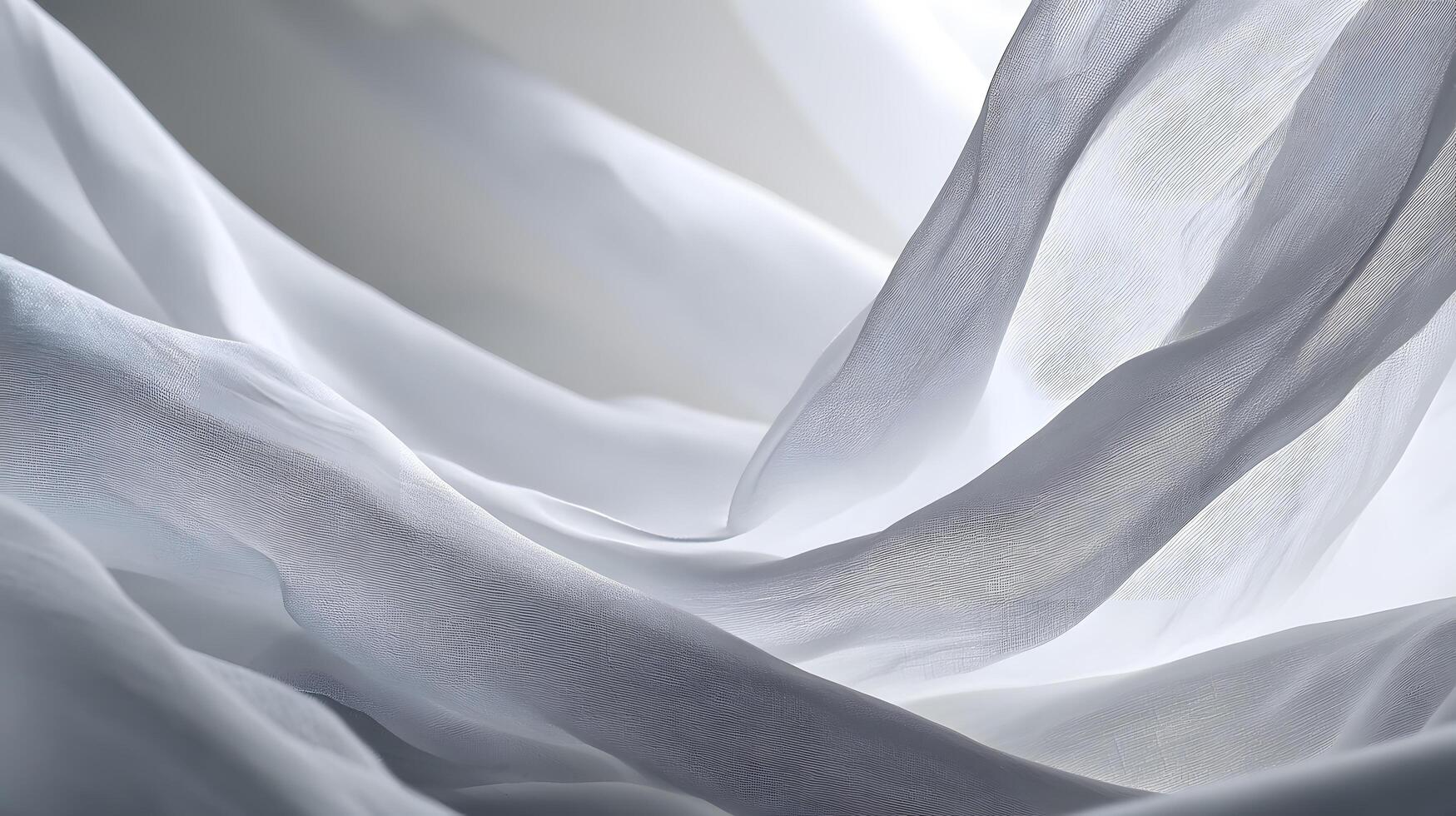 Sheer white fabric flowing elegantly in soft light creating abstract shapes and textures photo