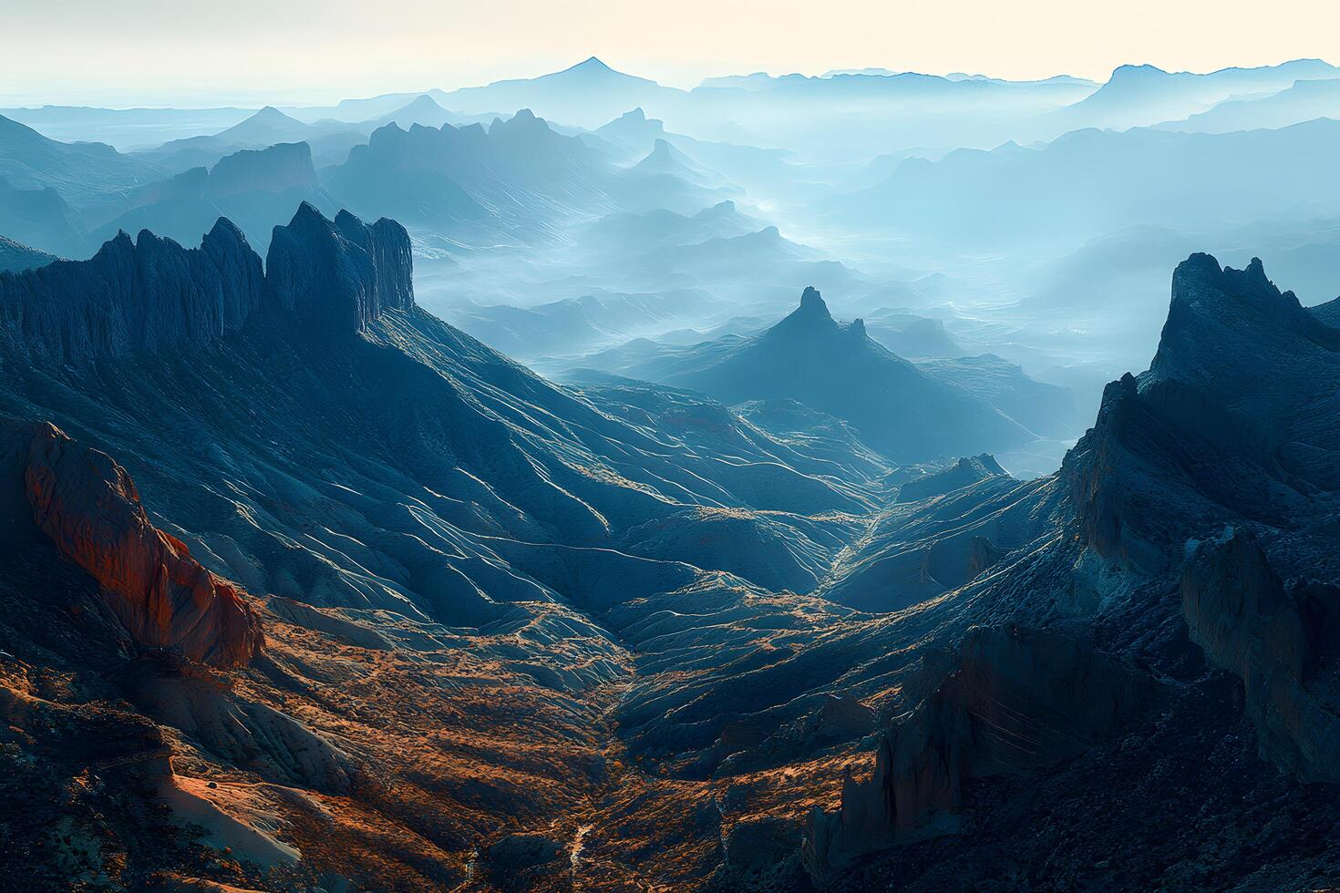 Majestic mountain range aerial view at sunrise dramatic blue hues and deep shadows rugged peaks and valleys photo