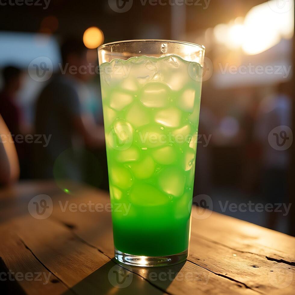 Refreshing Green Drink with Ice on Wooden Table photo