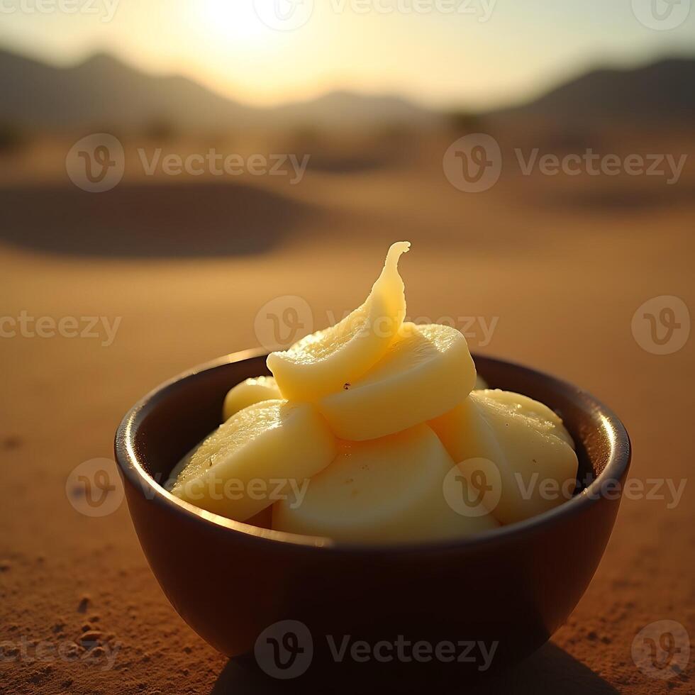 Bowl of Food in Desert Landscape at Sunset photo