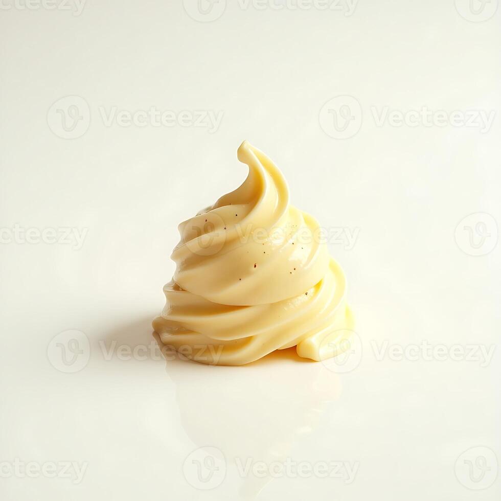 Vanilla Soft Serve Ice Cream Swirl on White Surface photo