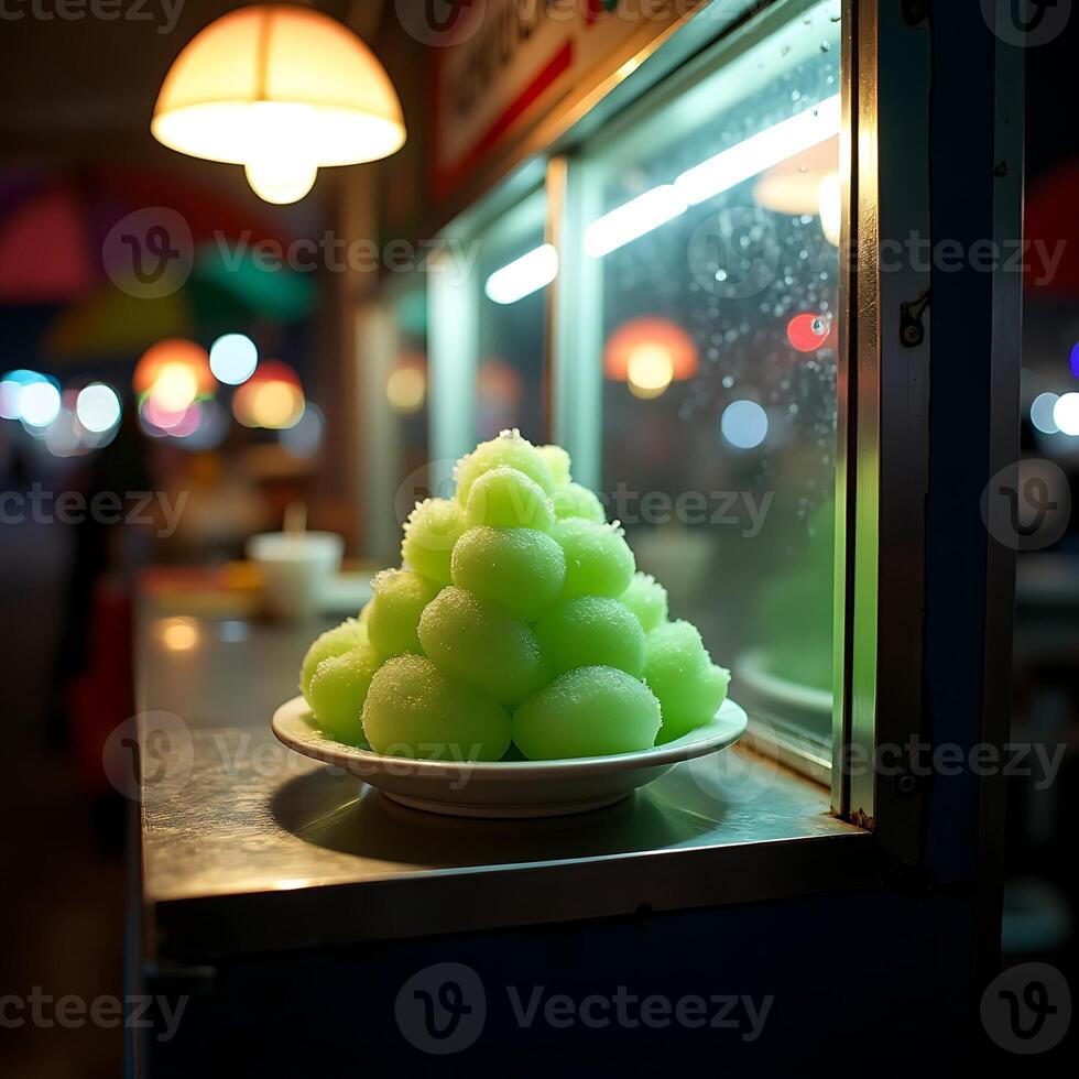Serving Green Sweets at Night Market Food Stall photo